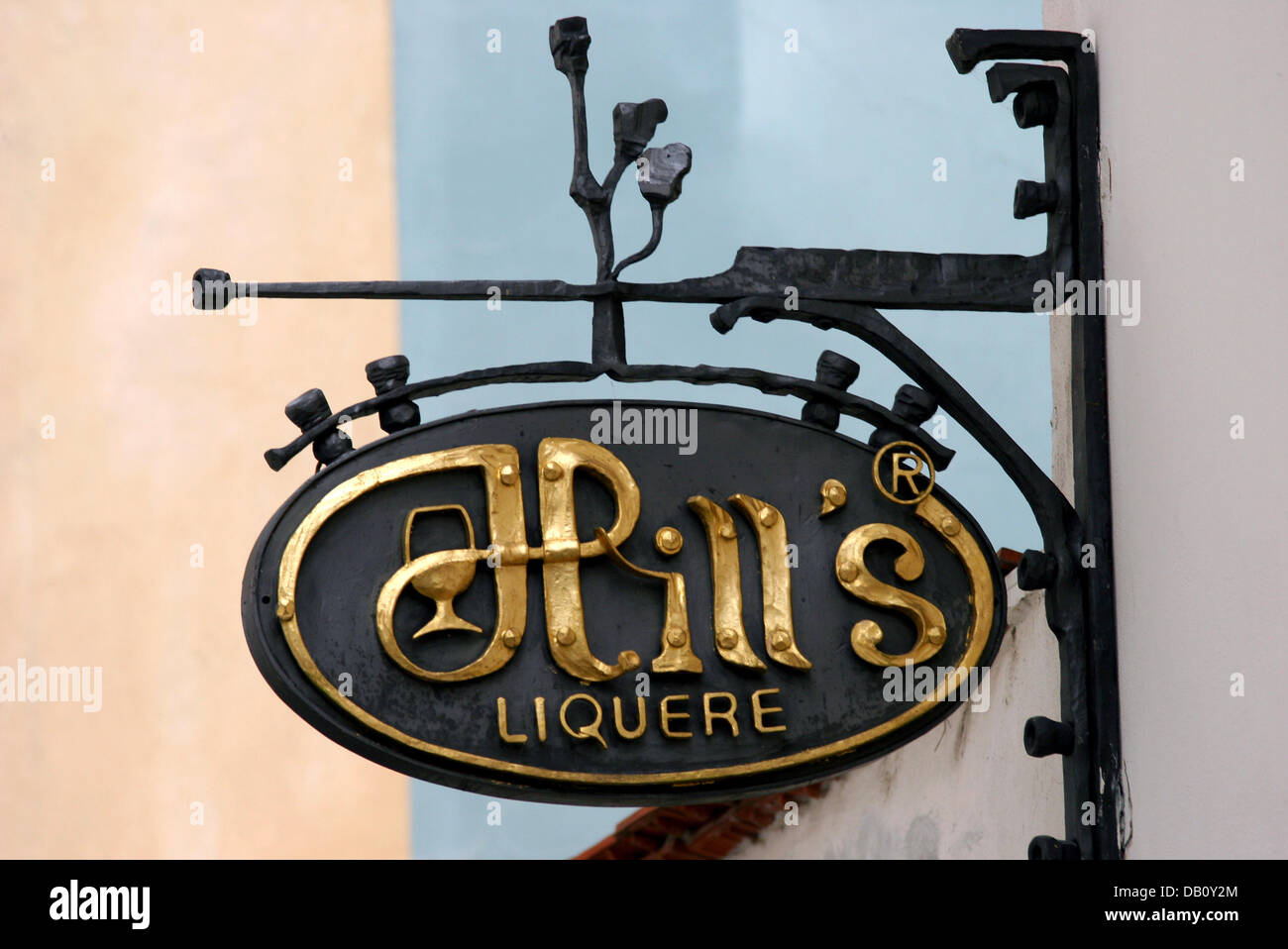 A wroughtiron company logo is attached on the outer wall of a Hill's