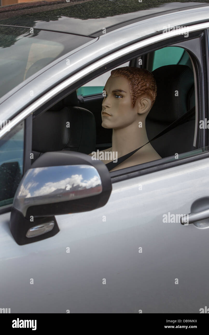 Mannequin in Drivers Seat of a car Stock Photo, Royalty Free Image