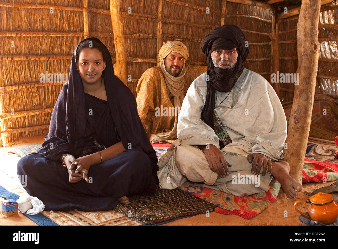 Inside Tuareg tent made from woven mats with village chief, in the