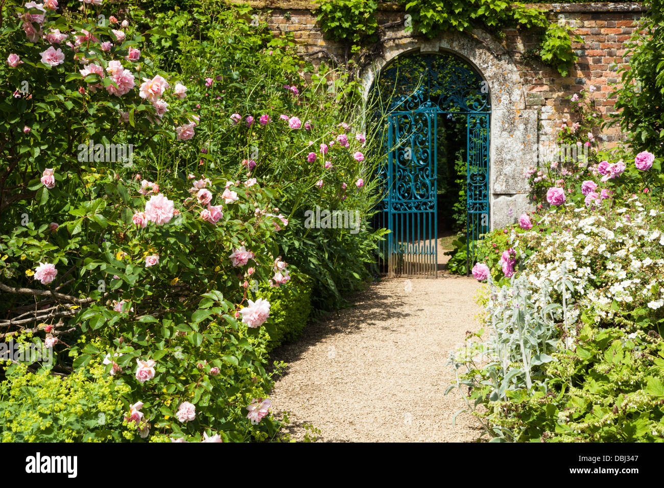 The arched gated entrance to the walled garden of Rousham House, with