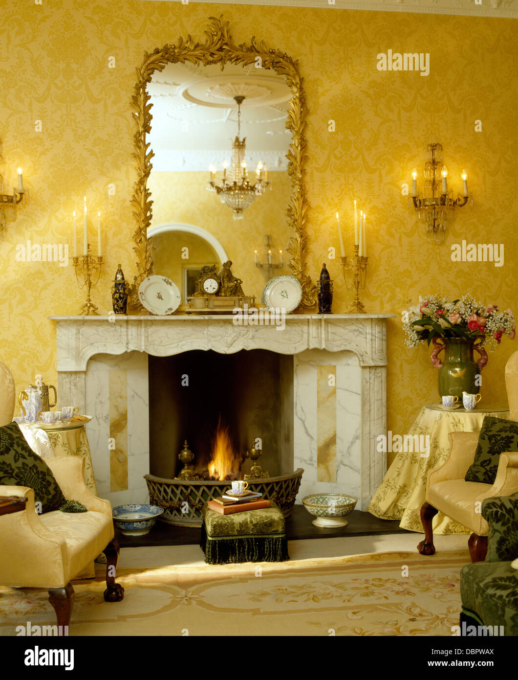 Antique Gilt Framed Mirror Above Marble Fireplace In Townhouse Antique Gilt Framed Mirror Above Marble Fireplace In Townhouse