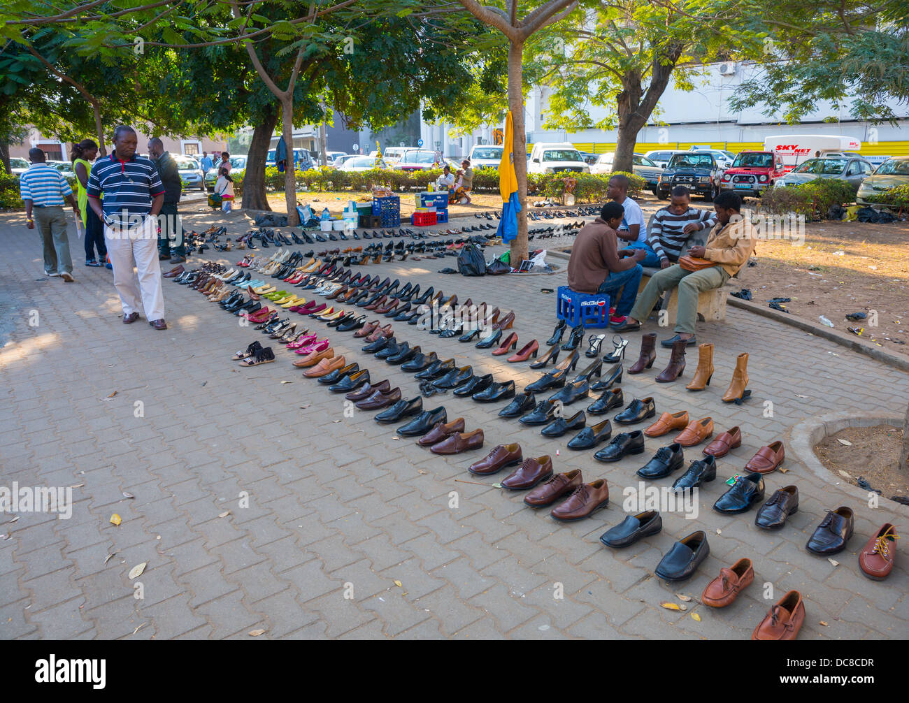 Man Selling Shoes In The Street Maputo Mozambique Stock Photo man-selling-shoes-in-the-street-maputo-mozambique-stock-photo