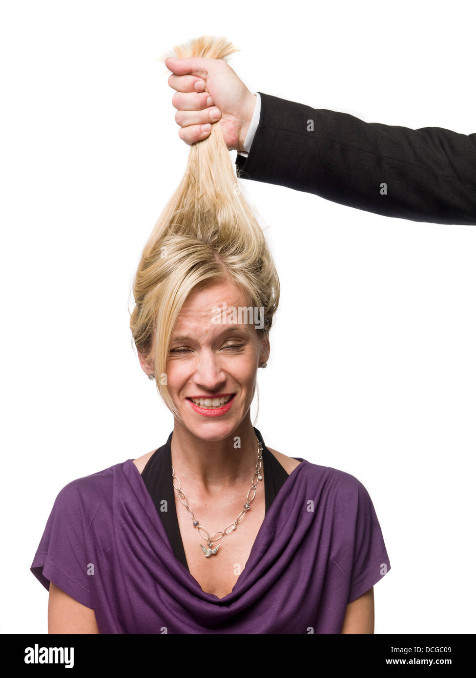 Man Pulling A Woman In The Hair Stock Photo Alamy