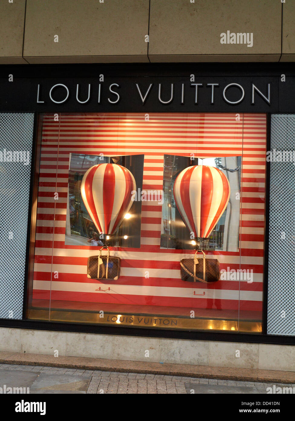 Louis Vuitton window display in New Cathedral Street Manchester UK Stock Photo, Royalty Free ...