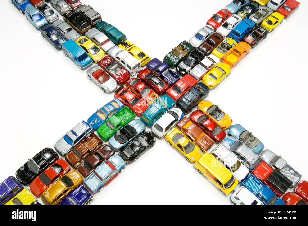 A traffic jam of miniature toy cars at an intersection Stock Photo