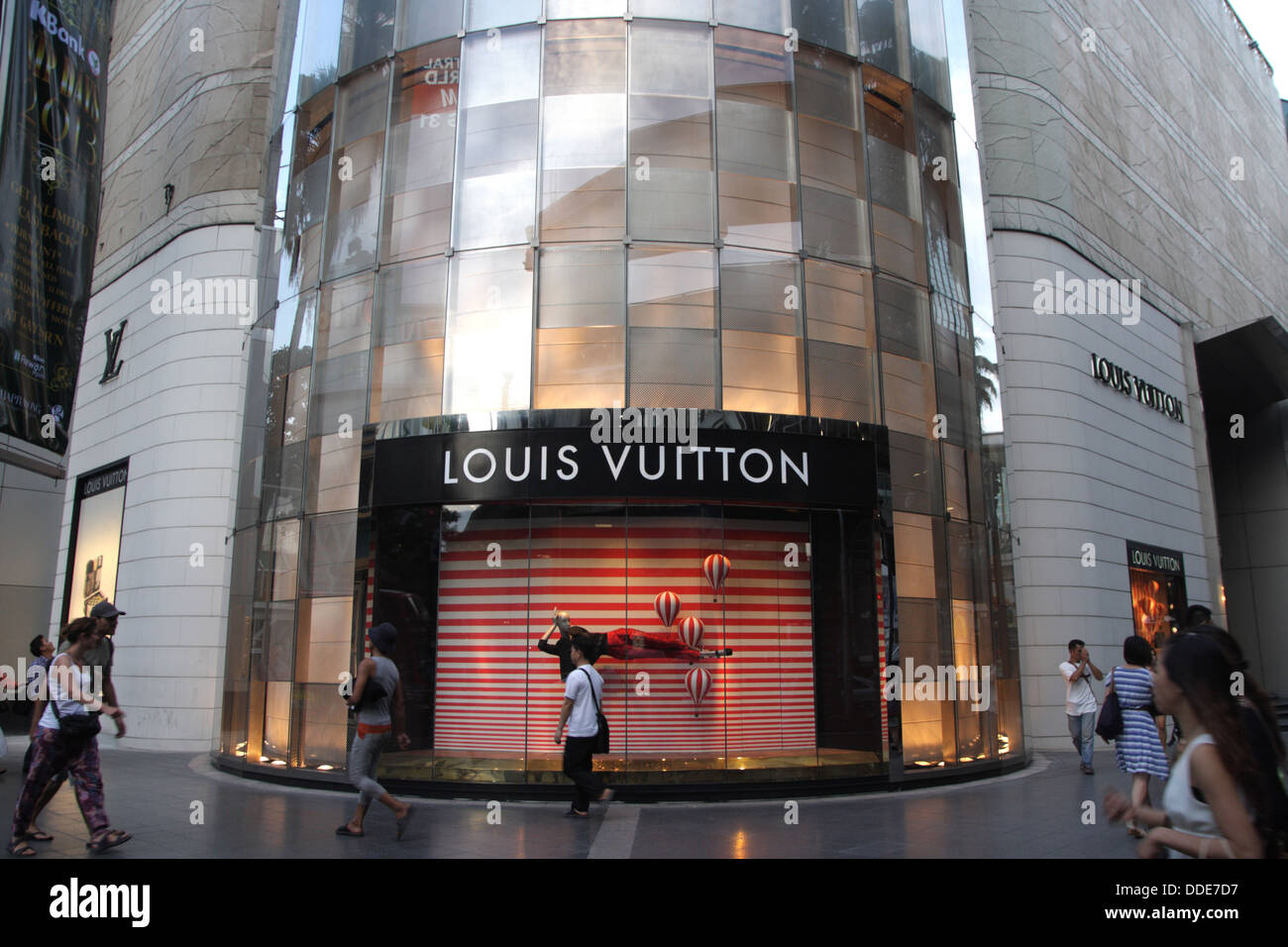 People walk passing through Louis Vuitton Shop at Gaysorn Plaza Stock Photo, Royalty Free Image ...