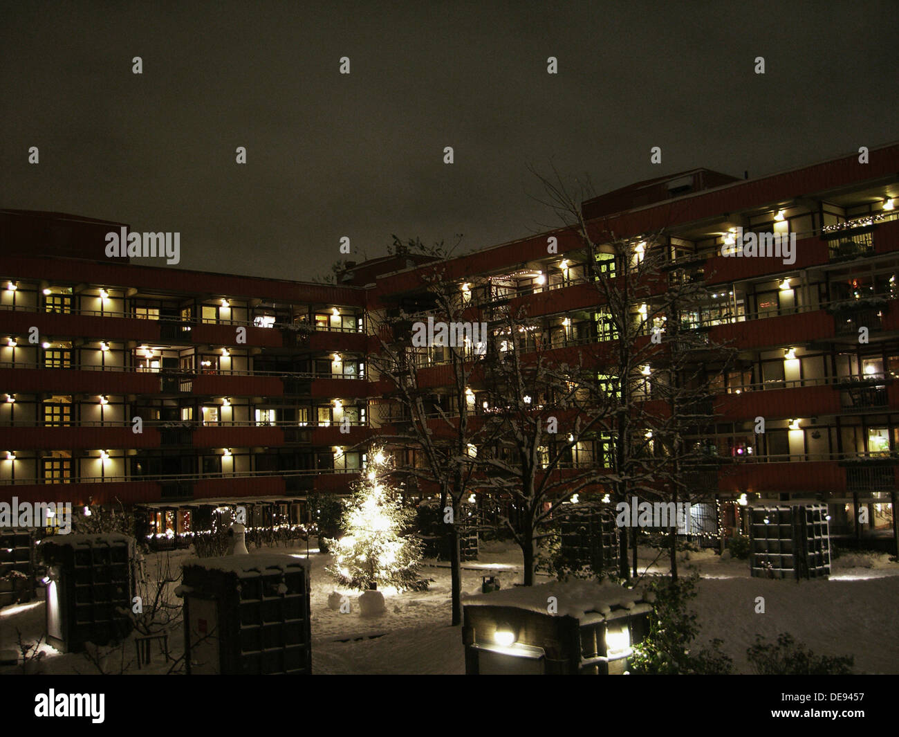 Apartment Building At Night apartment building and courtyard in snow at night stock photo Apartment Building At Night apartment building and courtyard in snow at night stock photo