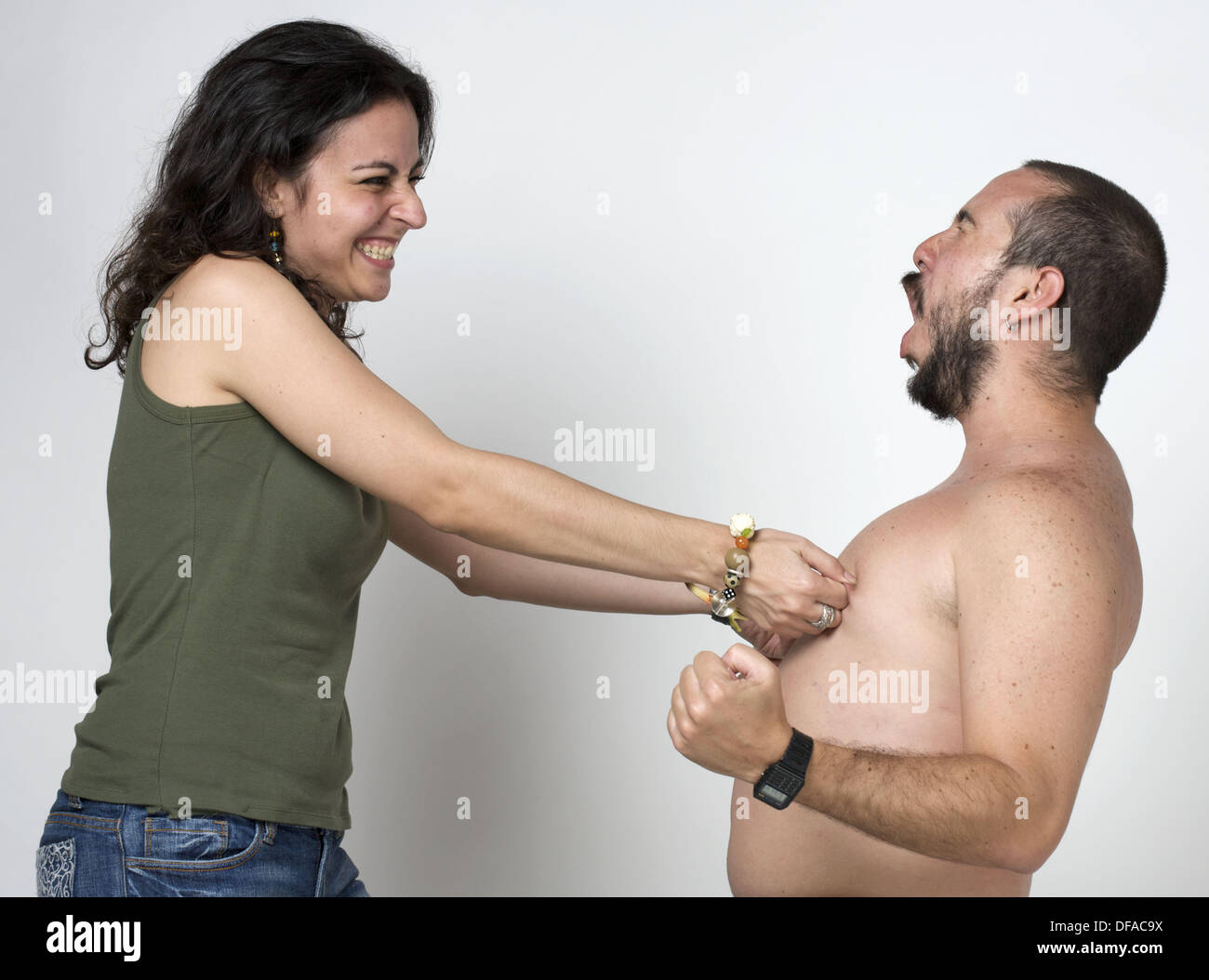Pinching her nipples