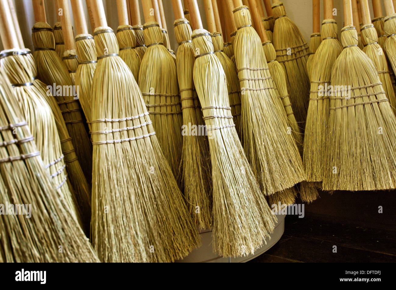 Making brooms for sale from special local straw at Historic Shaker