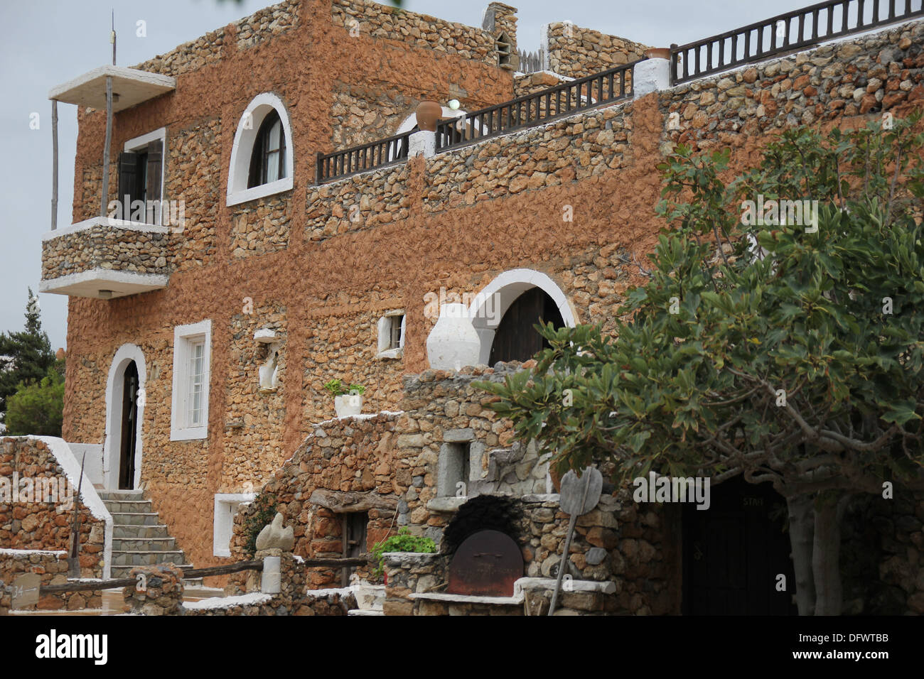 Traditional Greek Houses ancient greek house with a stone staircase and balcony stock photo Traditional Greek Houses ancient greek house with a stone staircase and balcony stock photo