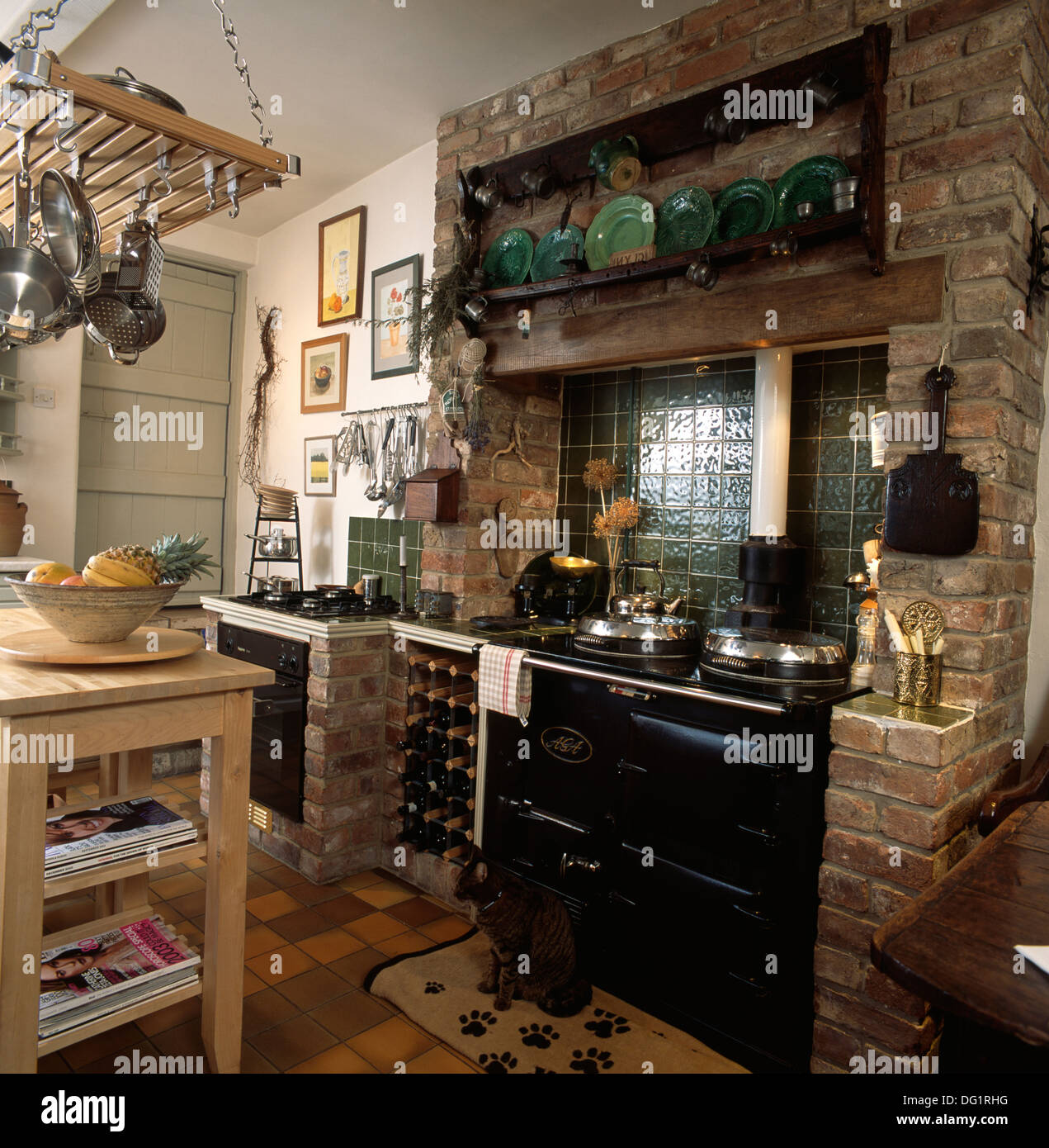 Wine Storage Rack Beside Black Aga In Exposed Brick Fireplace