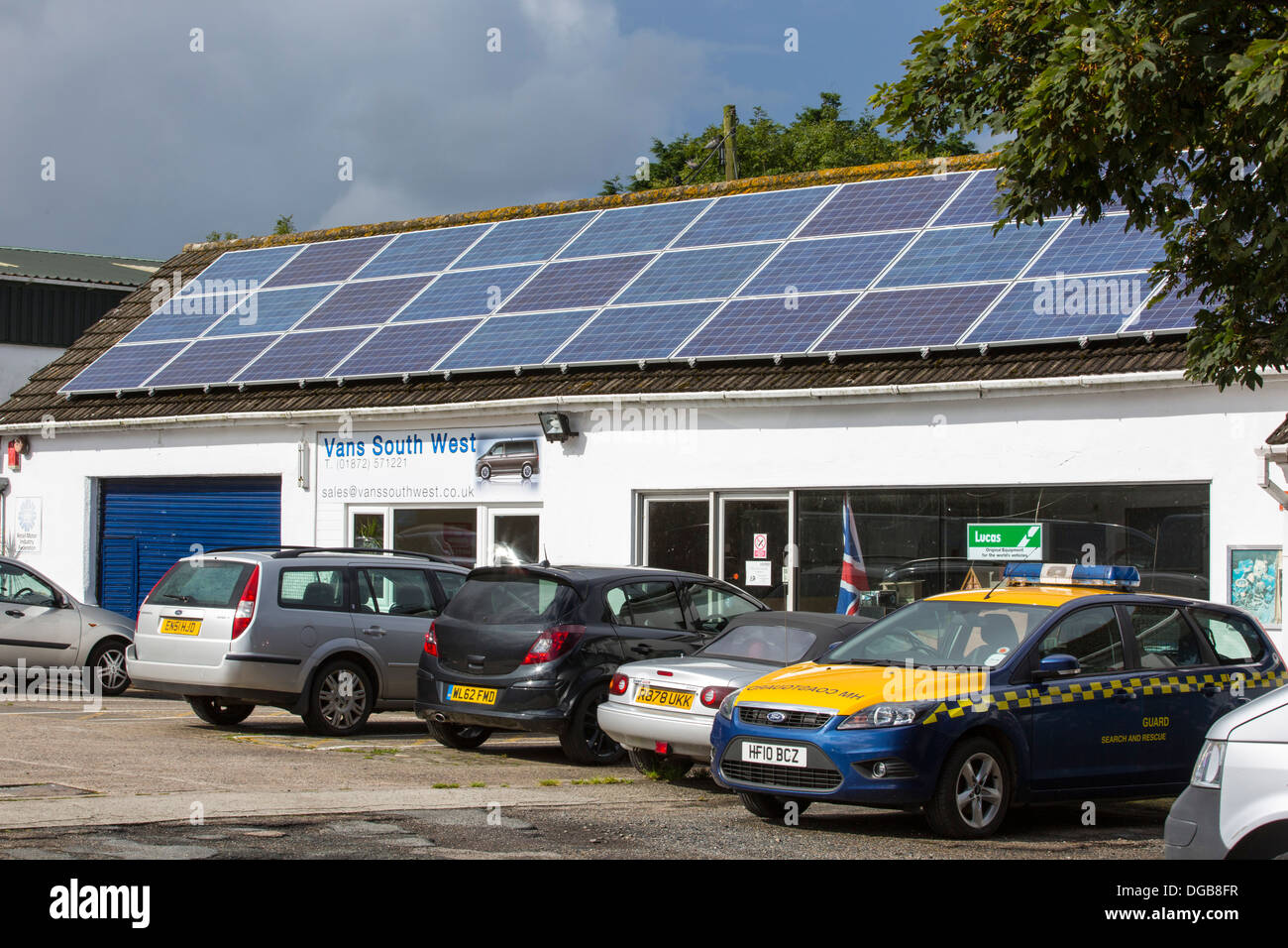Solar panels on a garage roof in Cornwall, UK Stock Photo, Royalty Free