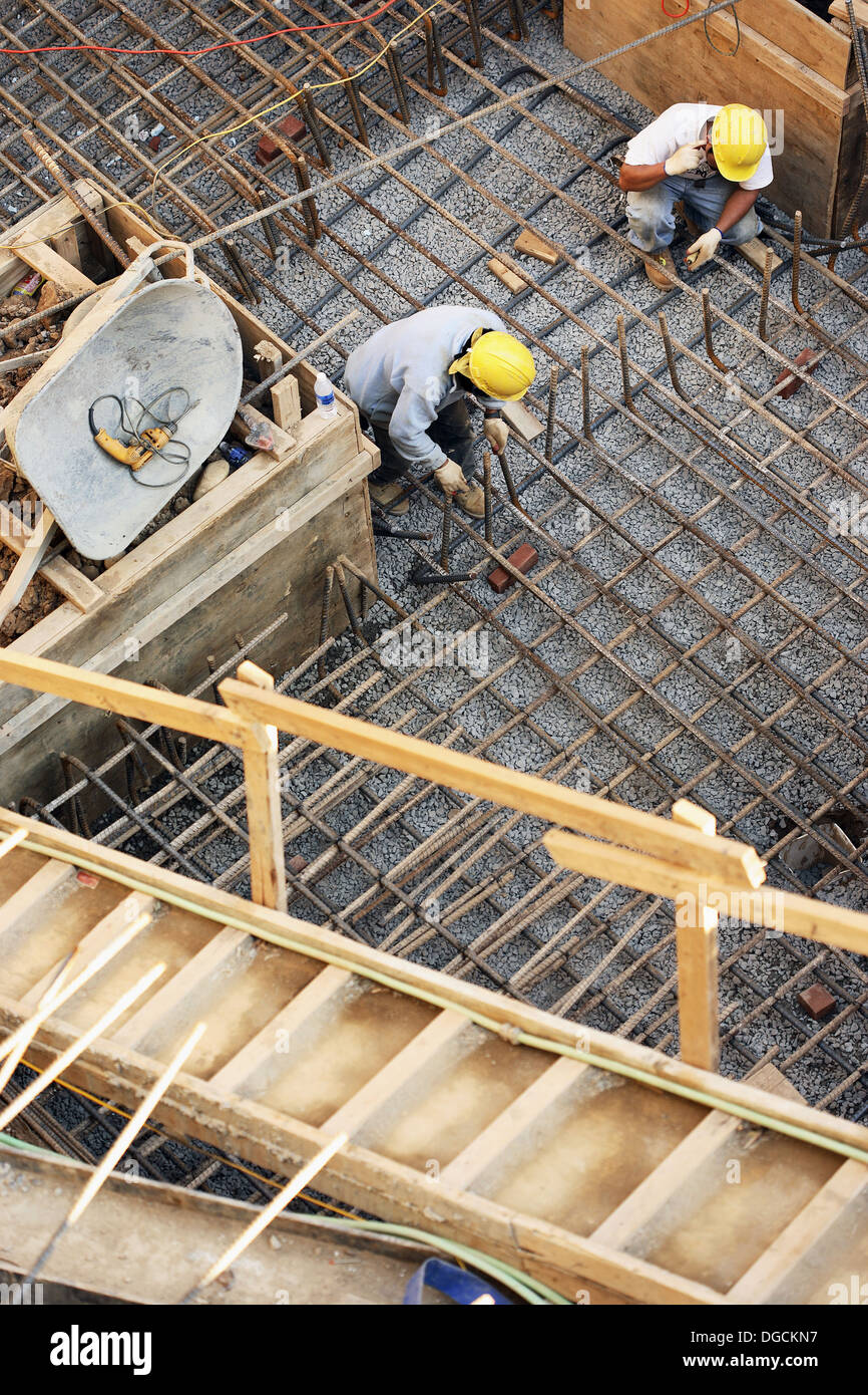 Construction workers working steel rebar foundation footing Stock Photo