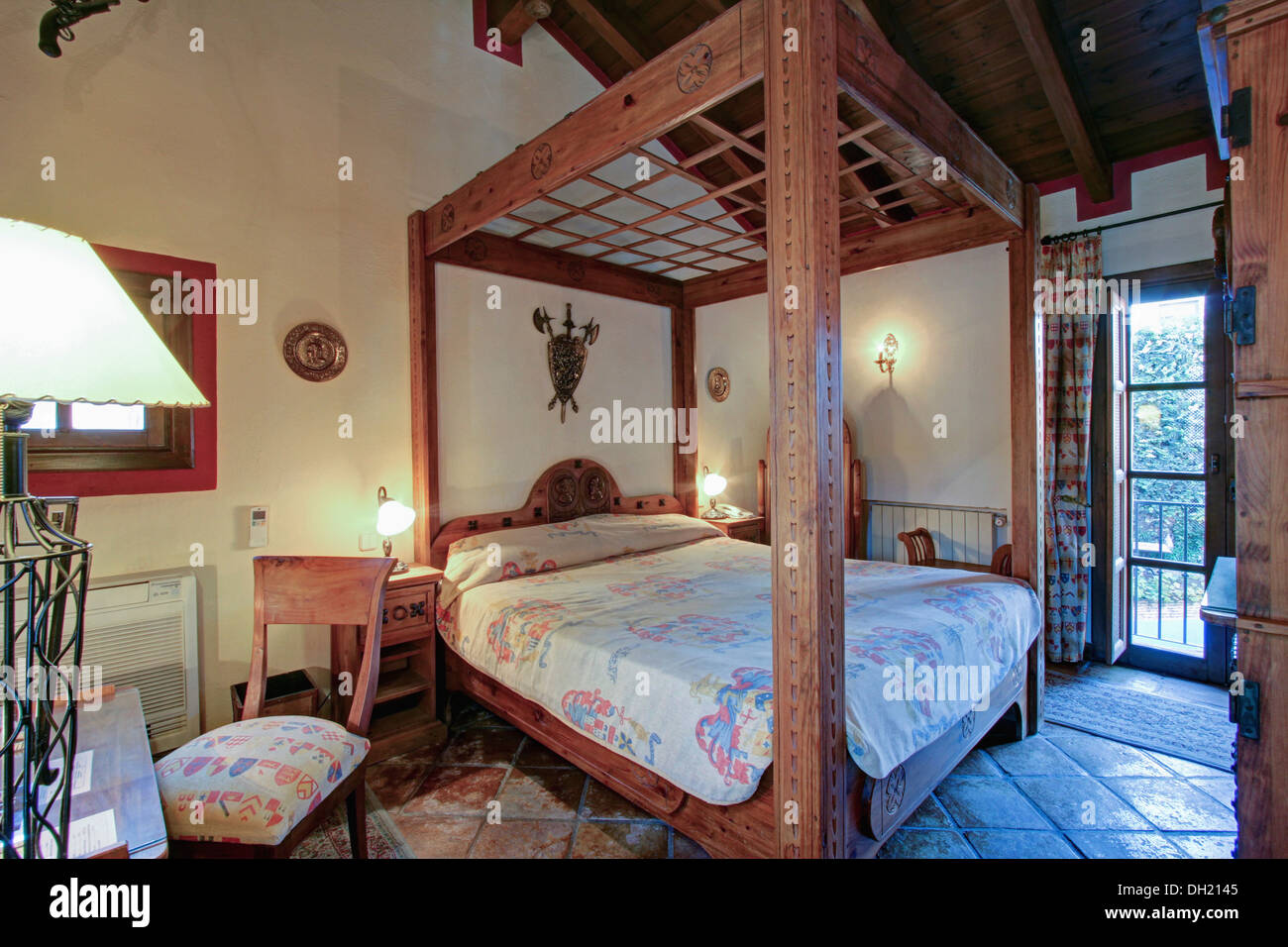 Rustic Wooden Four Poster Bed In Bedroom In Spanish Country Villa