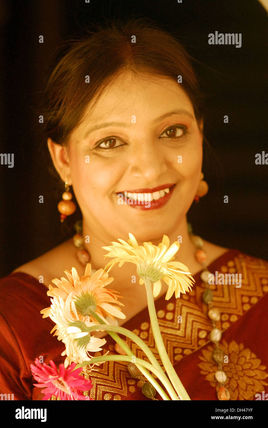 Stock Photo - happy smiling Indian woman portrait with white flowers India - MR#515 - happy-smiling-indian-woman-portrait-with-white-flowers-india-mr515-DH47YF