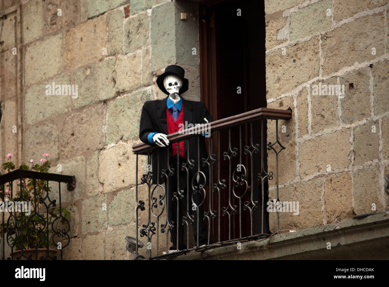 a-skeleton-wearing-a-suit-stands-on-the-balcony-of-el-sagrario-restaurant-DHCDAK.jpg
