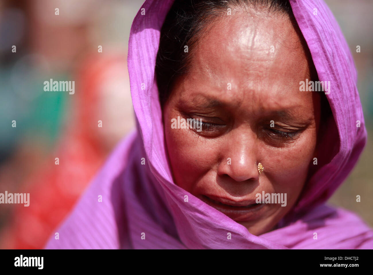 Mother of <b>a rana</b> plaza victim crying in front of graveyard. - dhaka-bangladesh-7th-november-2013-mother-of-a-rana-plaza-victim-crying-DHCTJ2