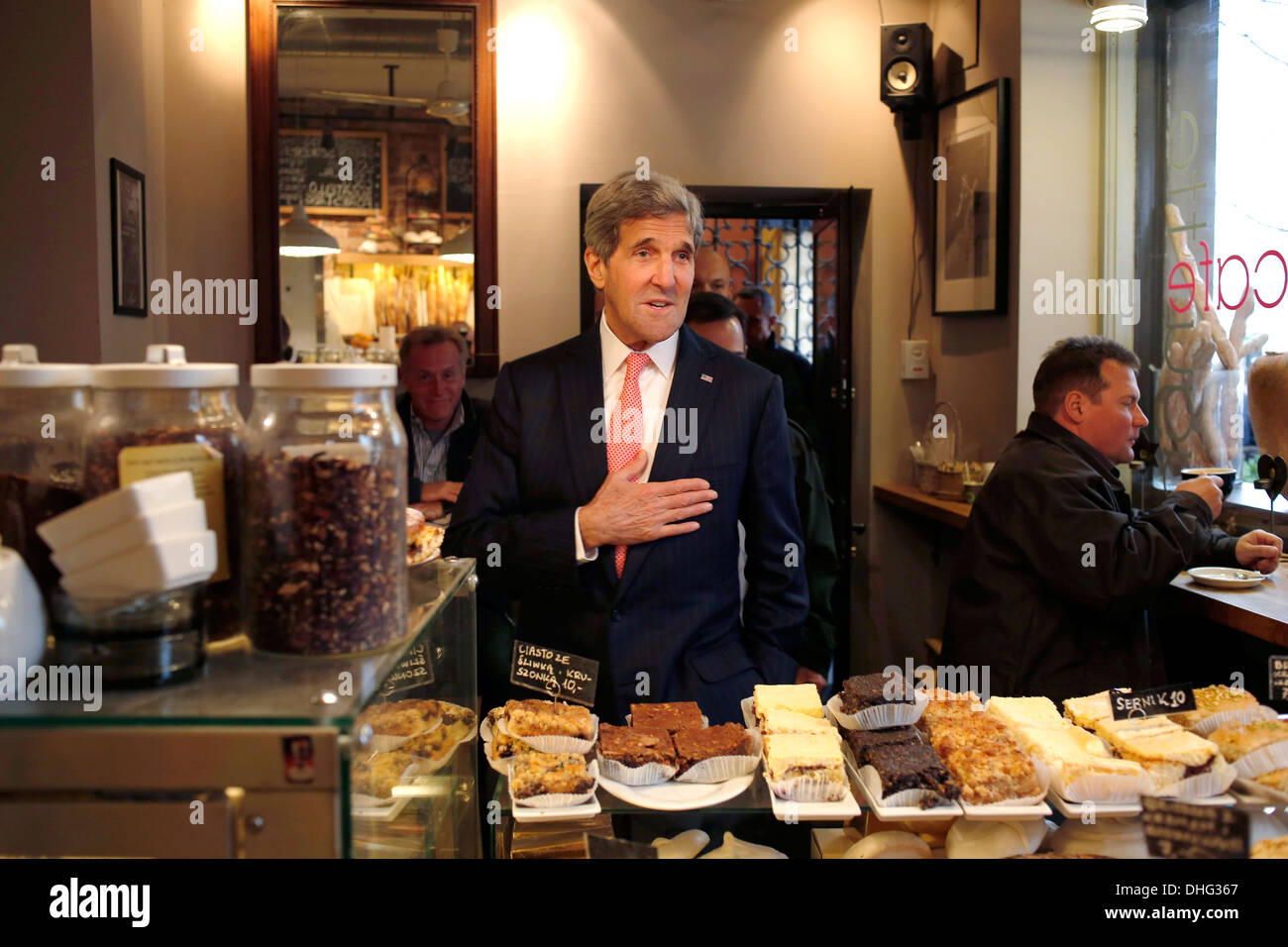 Us Secretary Of State John Kerry Greets A Bakery Worker Before Ordering