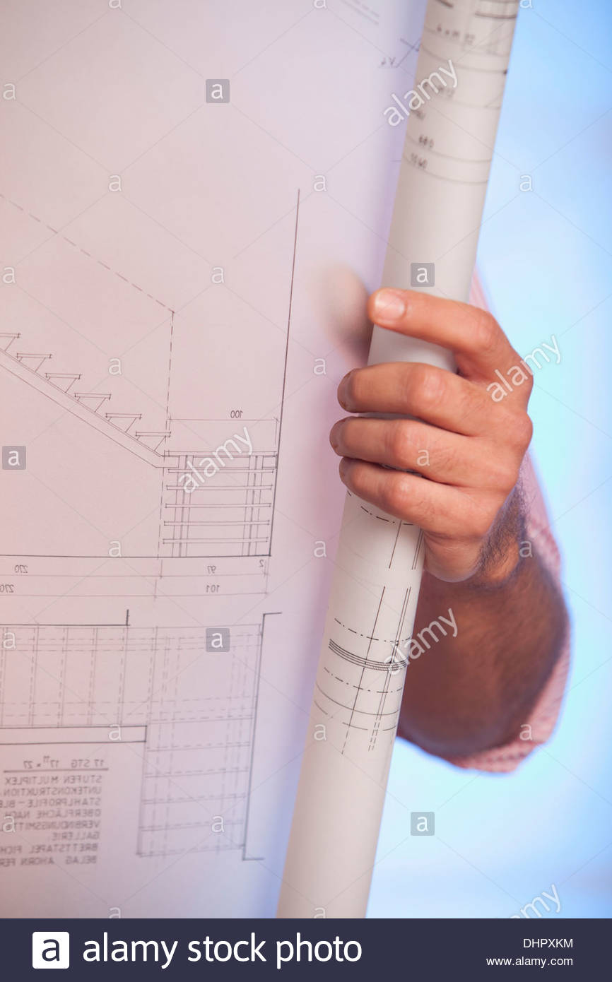 Architectural Drawing Blueprint man holding blueprint architectural drawing plan stock photo Architectural Drawing Blueprint man holding blueprint architectural drawing plan stock photo