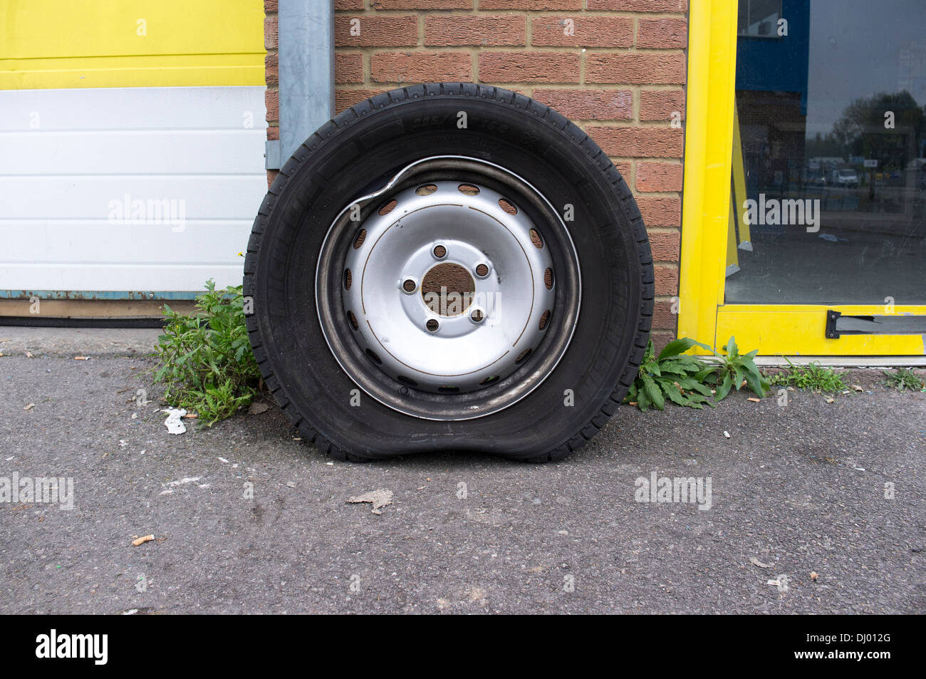 Damaged car wheel rim with flat tire Stock Photo, Royalty Free Image