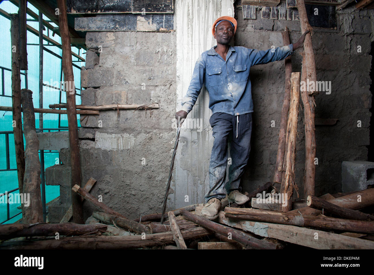 Construction worker on a high rise building site, Nairobi, Kenya Stock