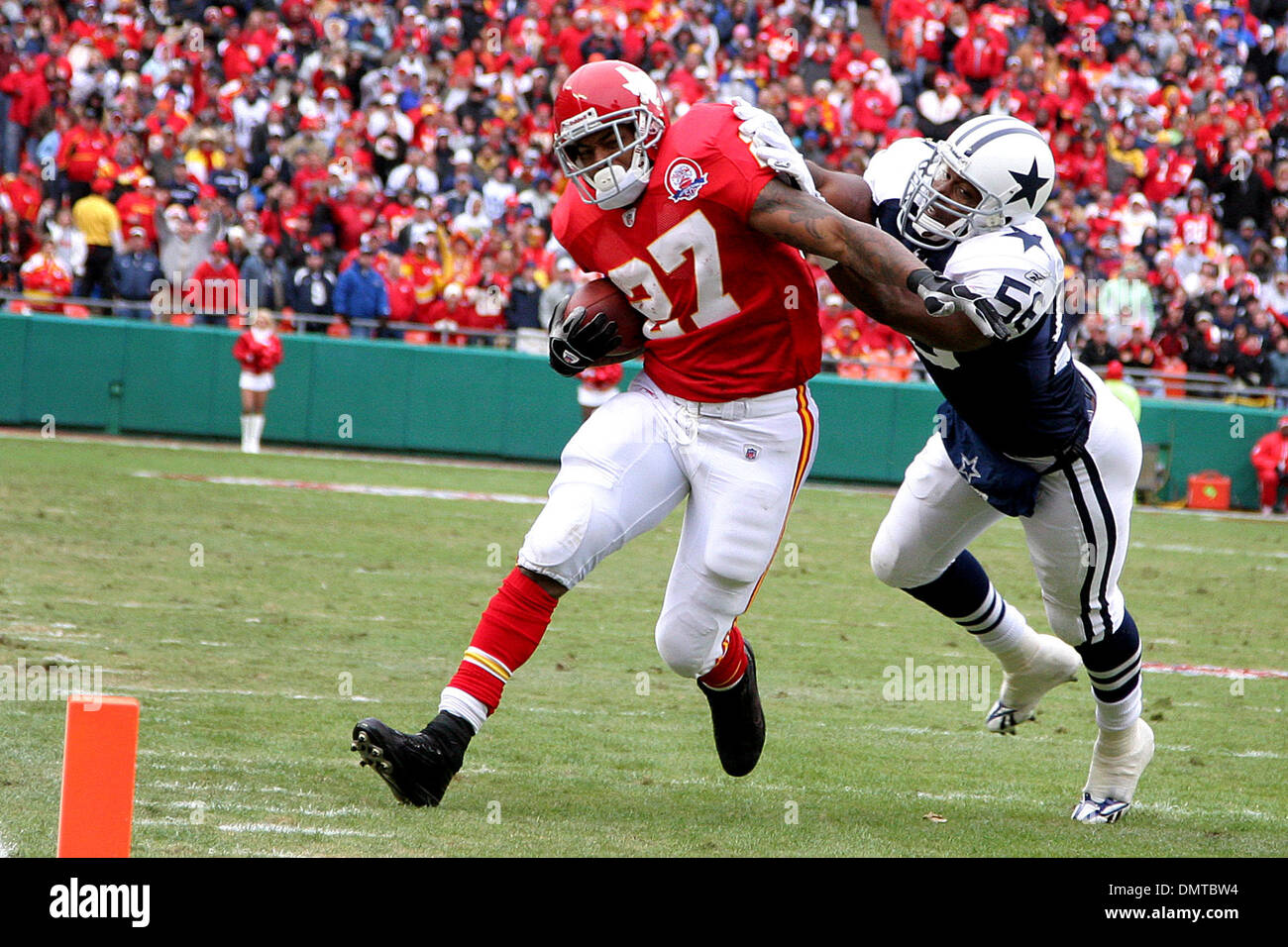 Dallas Cowboys linebacker Bradie James (56) pushes Kansas City Chiefs