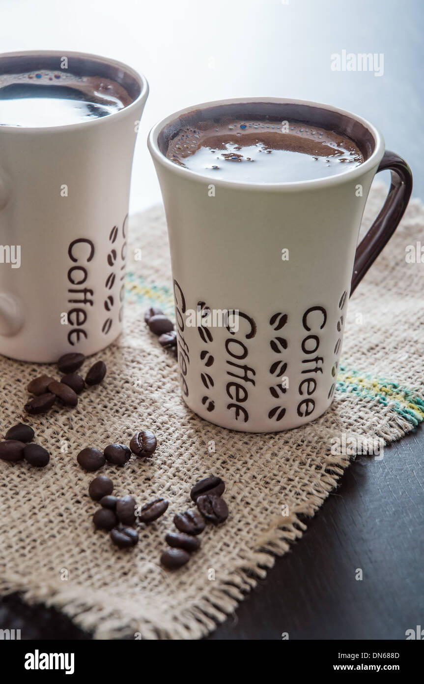 Two Modern Espresso Cups On A Wooden Table Stock Photo Royalty - Stock Photo Two Modern Espresso Cups On A Wooden Table two modern espresso cups on a wooden table stock photo royalty - stock photo two modern espresso cups on a wooden table