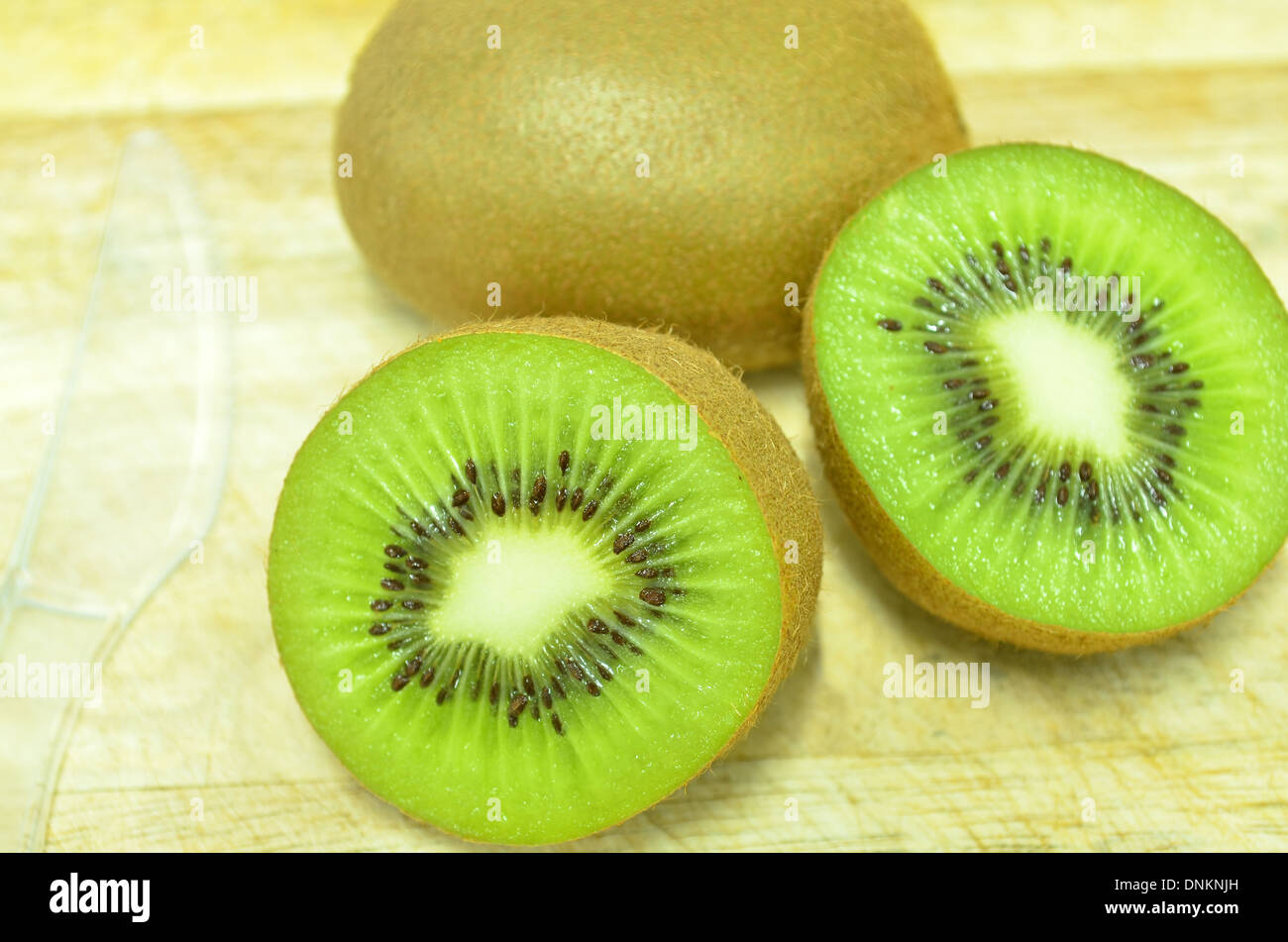 Whole Kiwi Fruit And His Sliced Segments Isolated On White Background