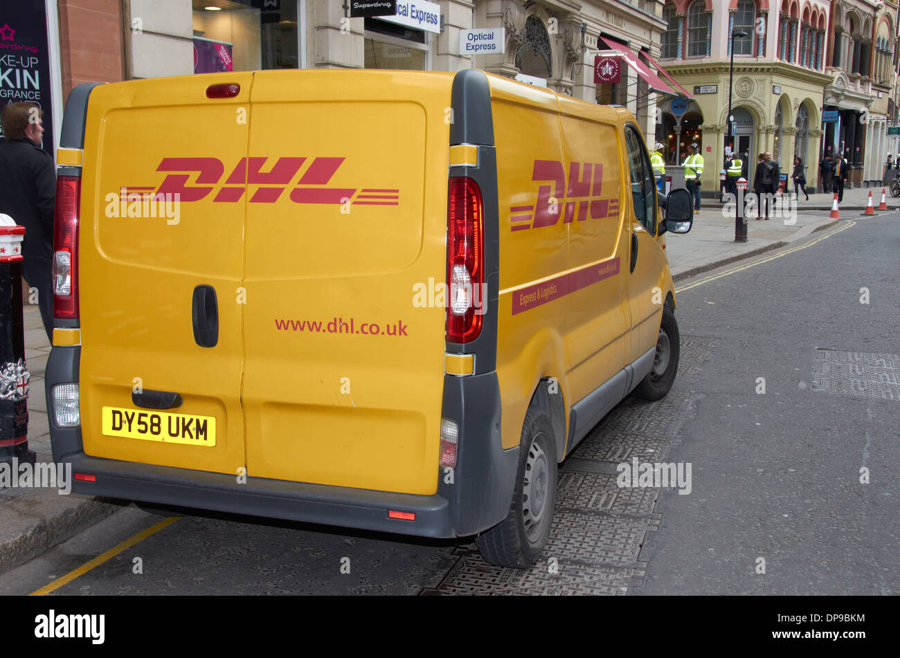 DHL delivery van on a city street Stock Photo, Royalty Free Image