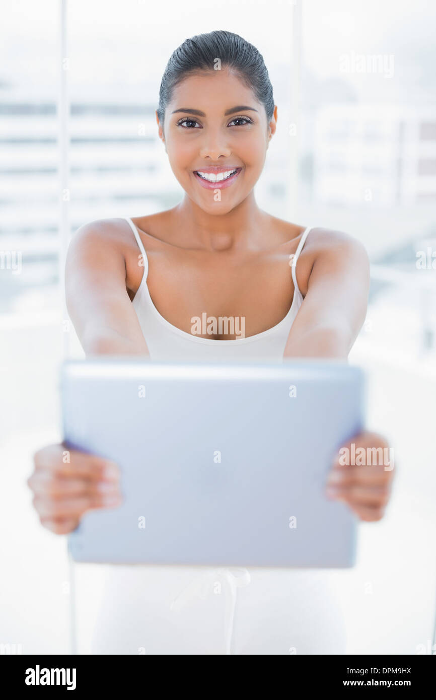 Happy Toned Brunette Holding Tablet Stock Photo Alamy