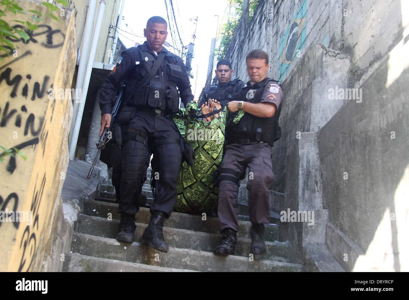Rio De Janeiro, Brazil. 4th Feb, 2014. Security personnel carry the