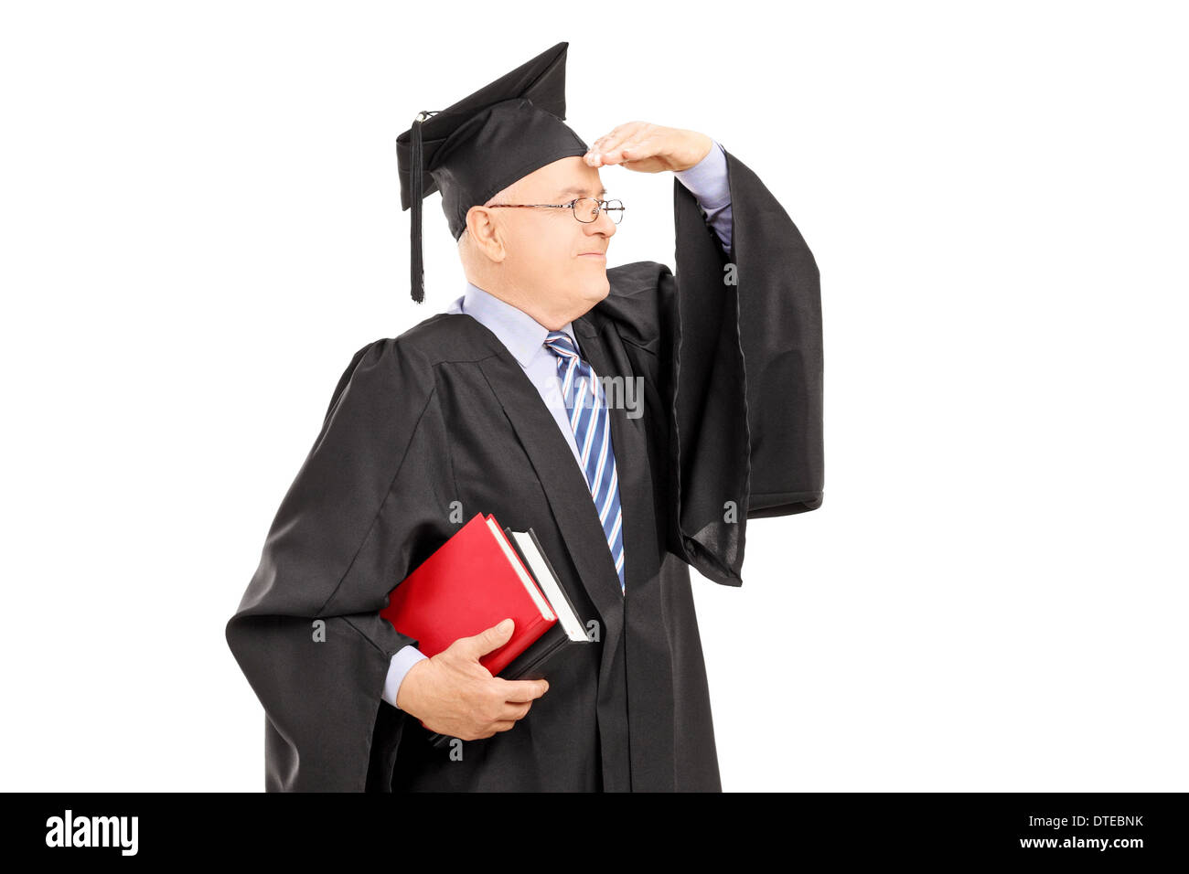 Male College Professor In Graduation Gown Looking With Hand Over ...