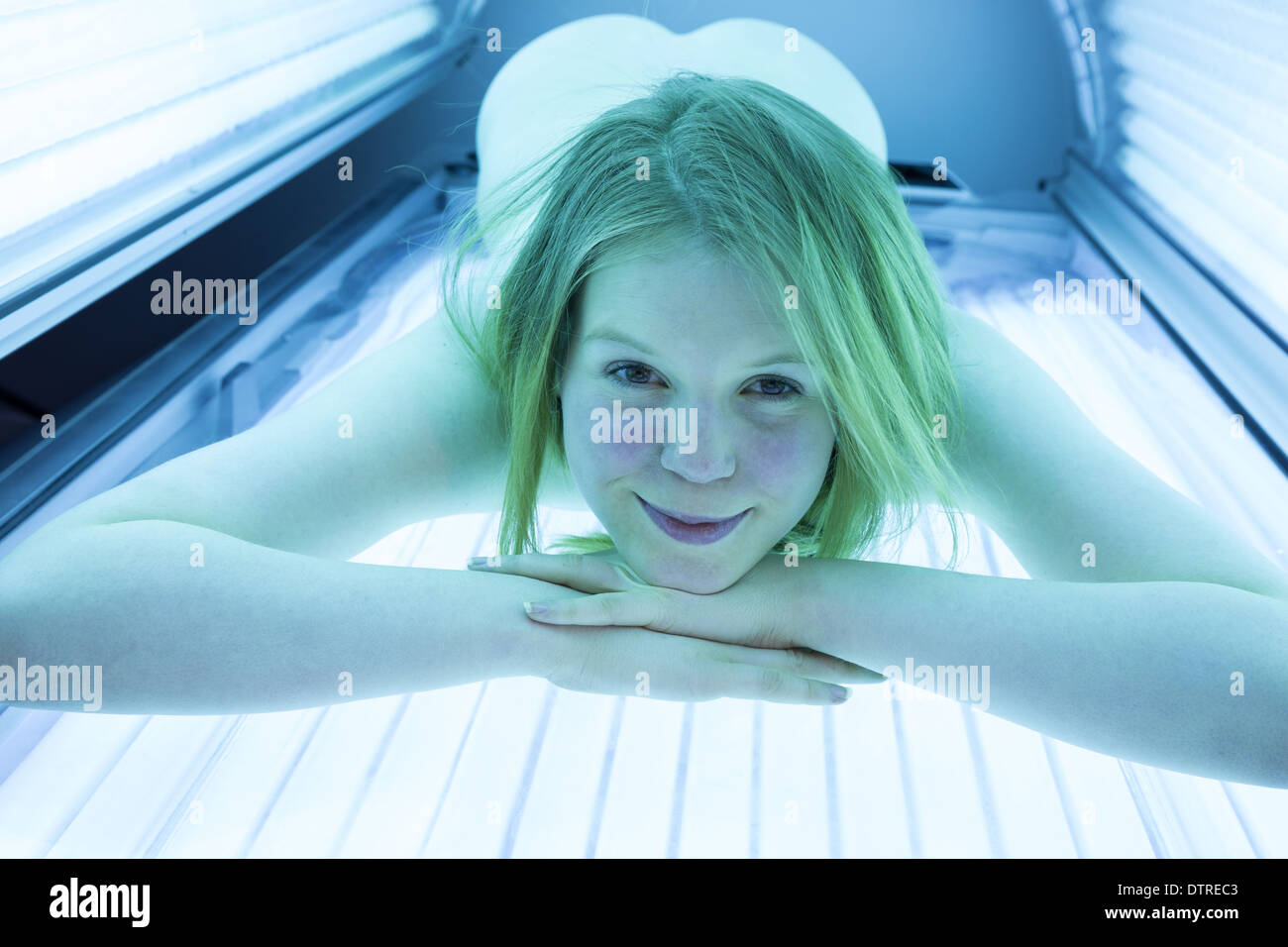 Naked Woman Relaxing On Tanning Bed In Solarium Stock Photo Alamy