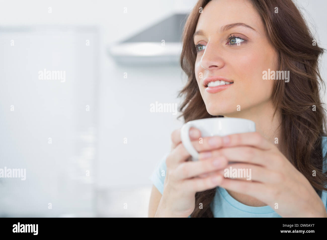 Pretty Brunette Drinking Coffee Stock Photo Alamy