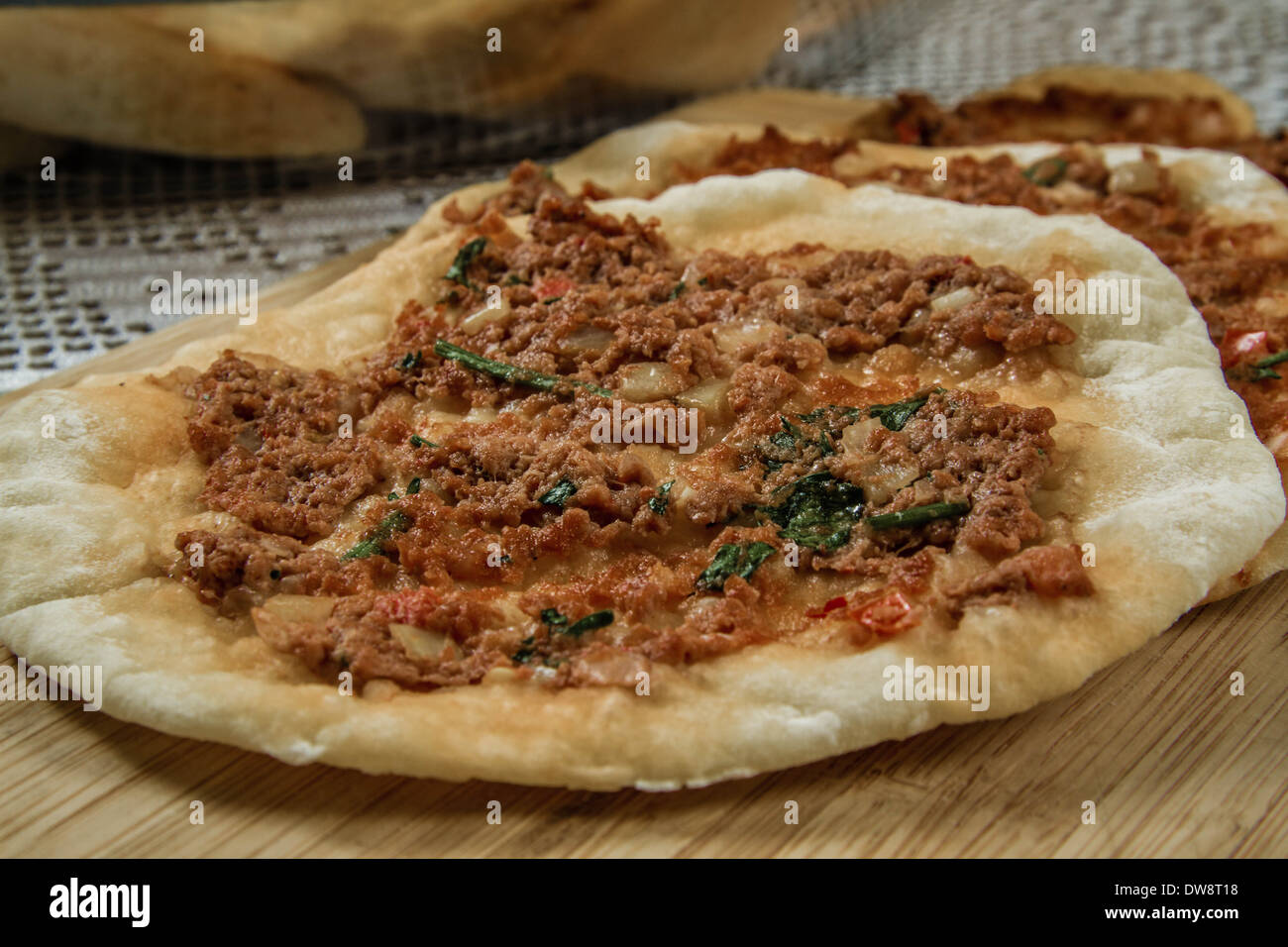 Hommade_turkish_pizza_lahmacun_on_a_hand