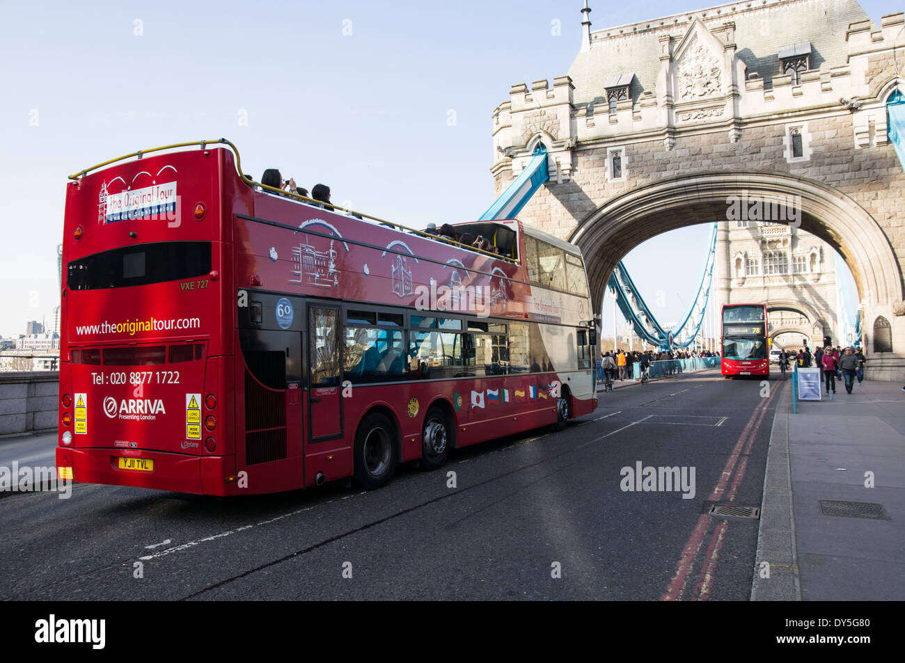Opentop sightseeing bus on Tower Bridge in London England United Stock Photo, Royalty Free