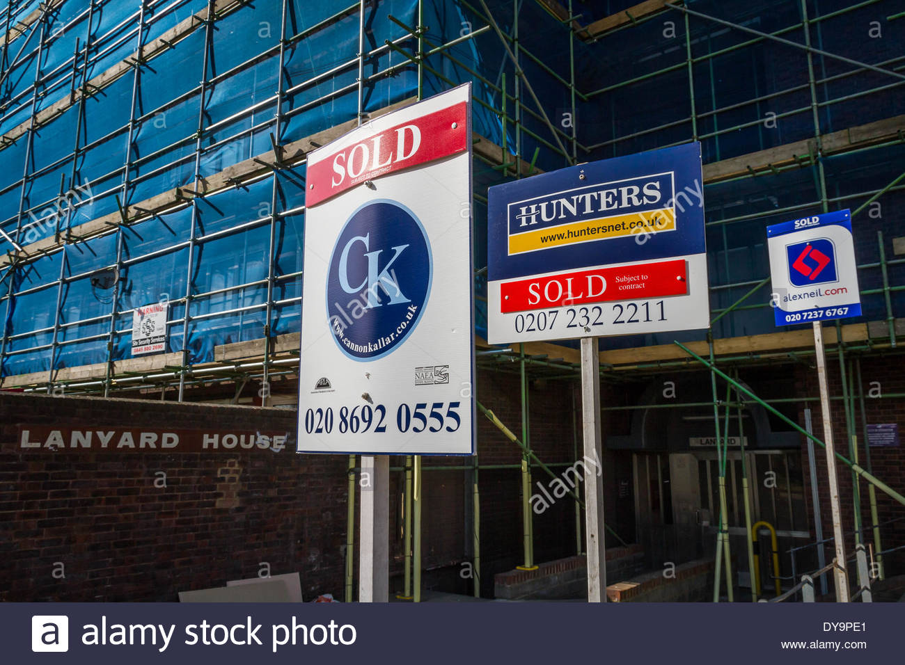 Estate agents boards advertising sale or rental seen outside London Stock Photo, Royalty Free
