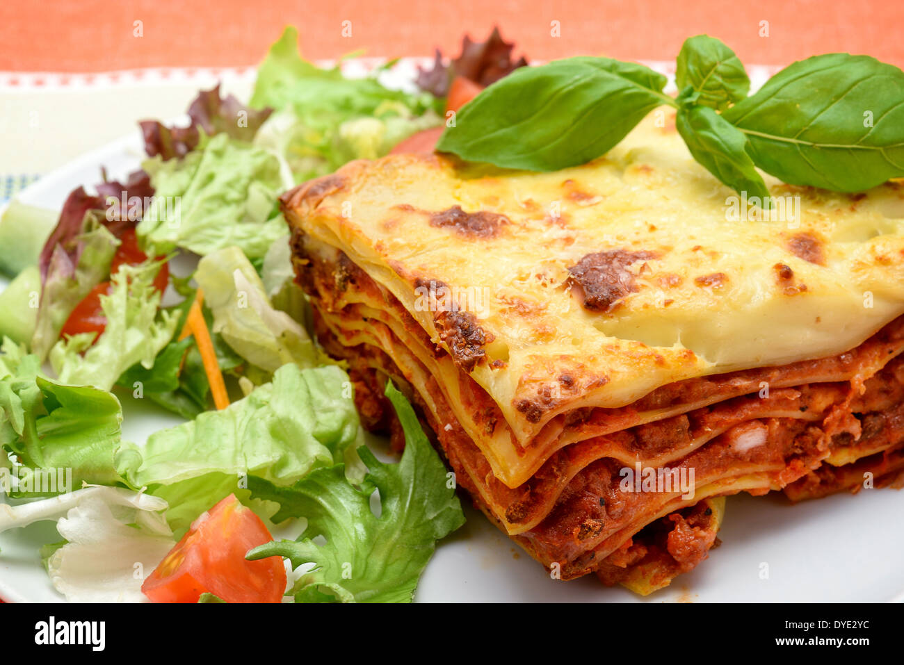 Beef Lasagne al Forno with salad studio shot Stock Photo, Royalty