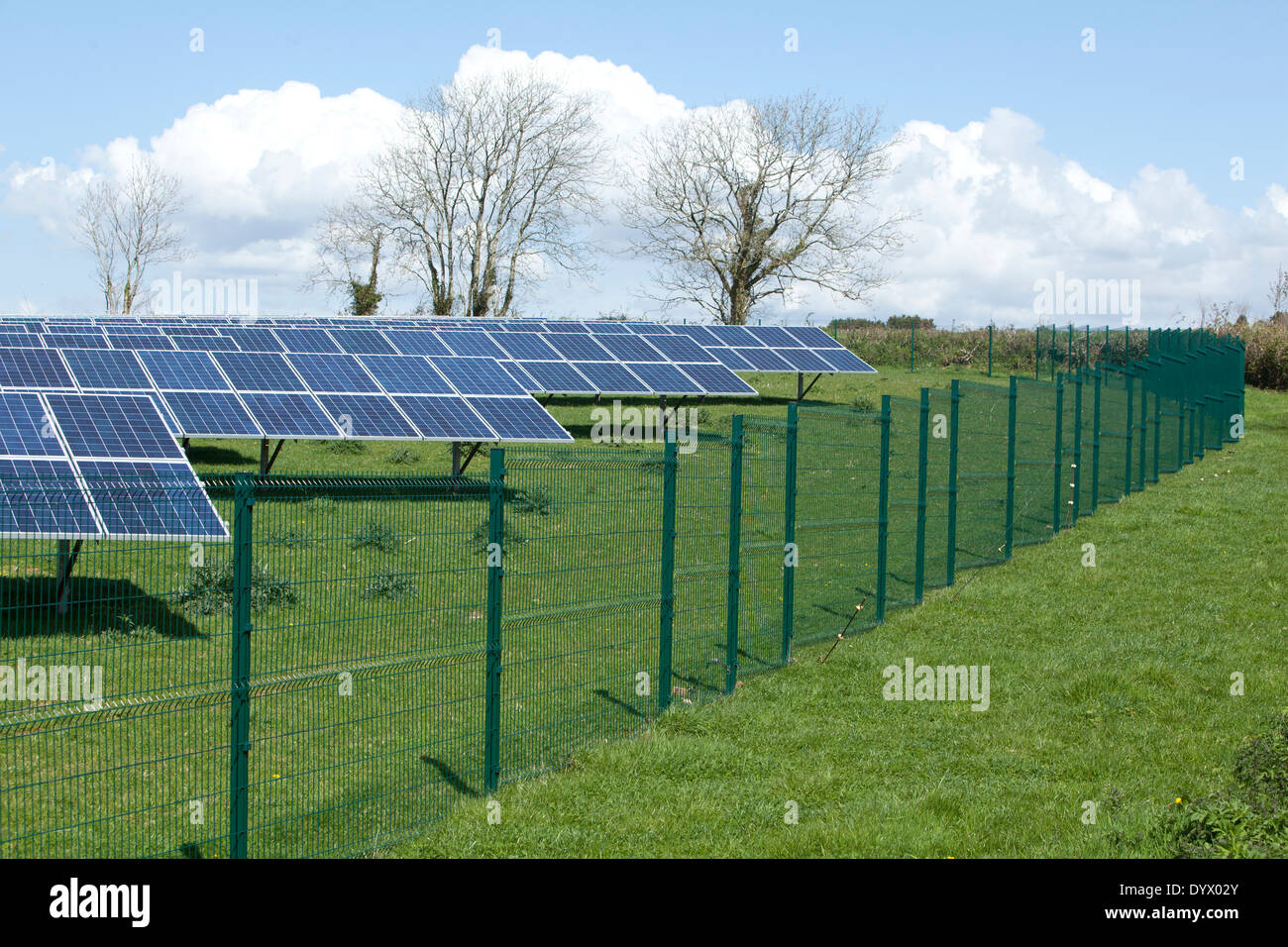 A new large Solar Farm in Cornwall with its fence around it Stock Photo