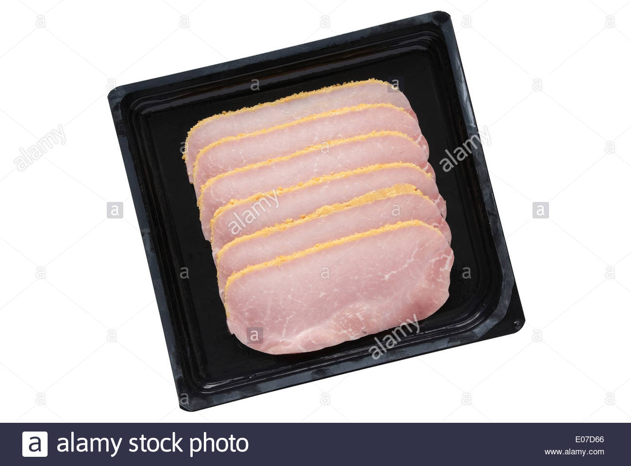 Sliced breaded cooked ham in black plastic packaging tray isolated on