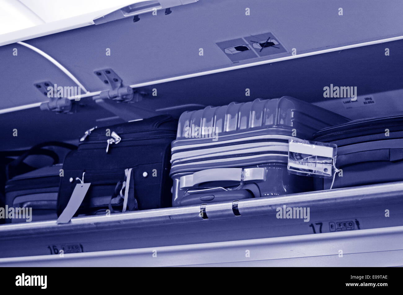 Carryon and overhead Baggage in aircraft baggage compartment above