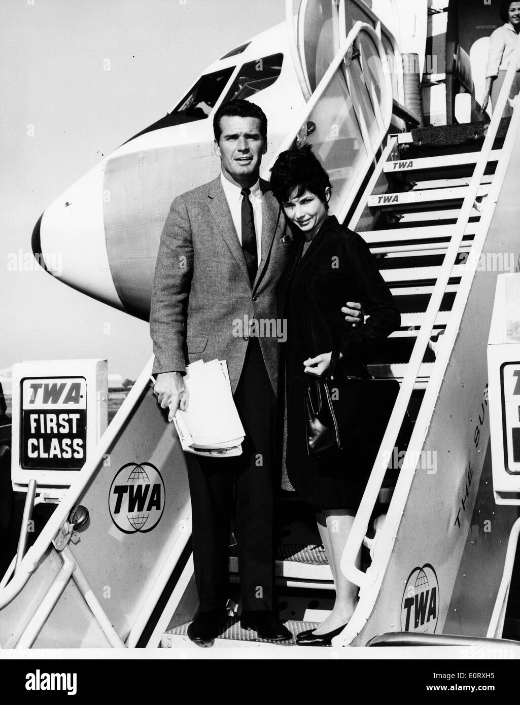 Actor James Garner and wife Lois Clarke boarding an airplane Stock