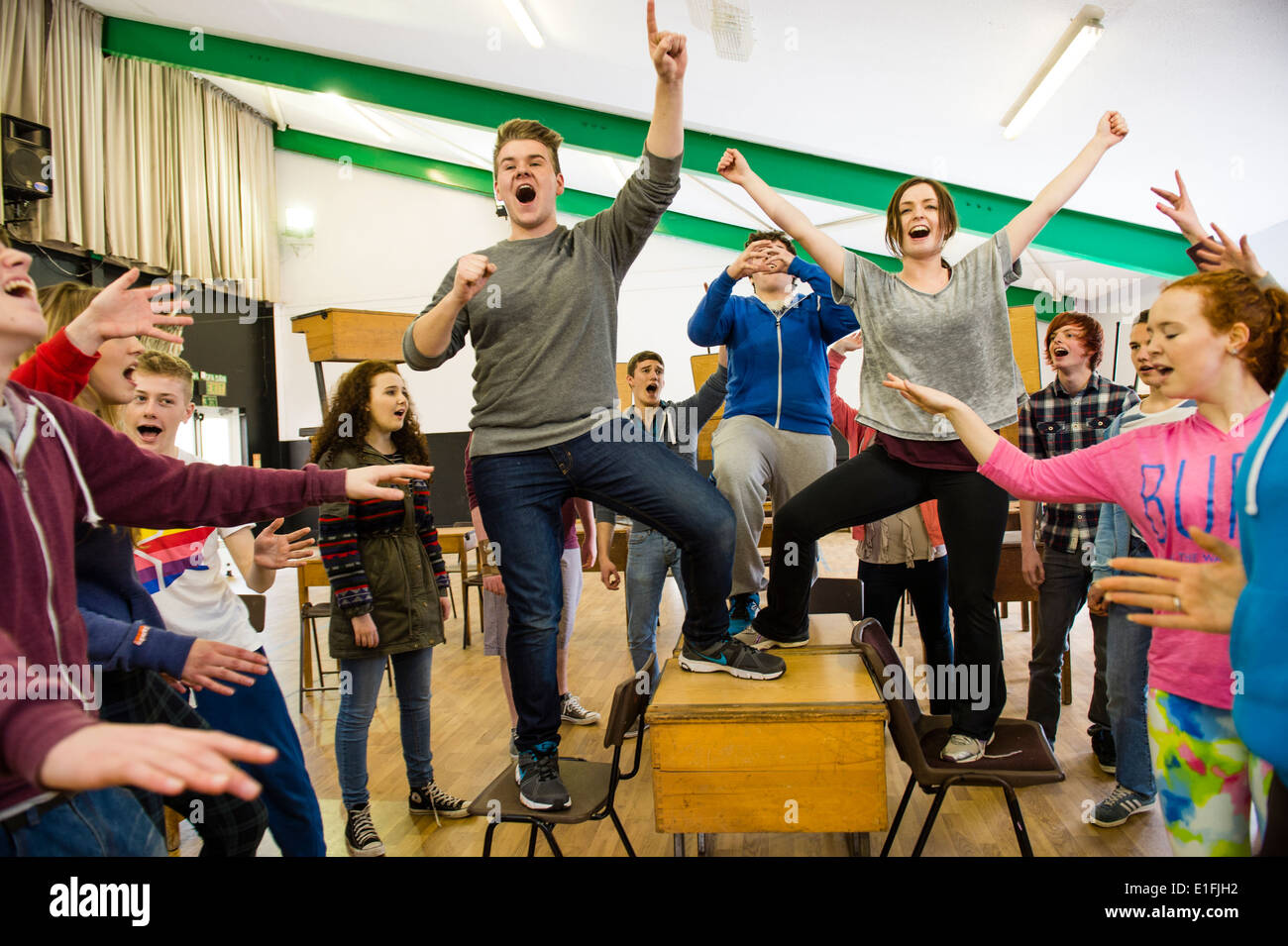 A Group Of Teenagers In Youth Theatre Rehearsing Singing And Acting
