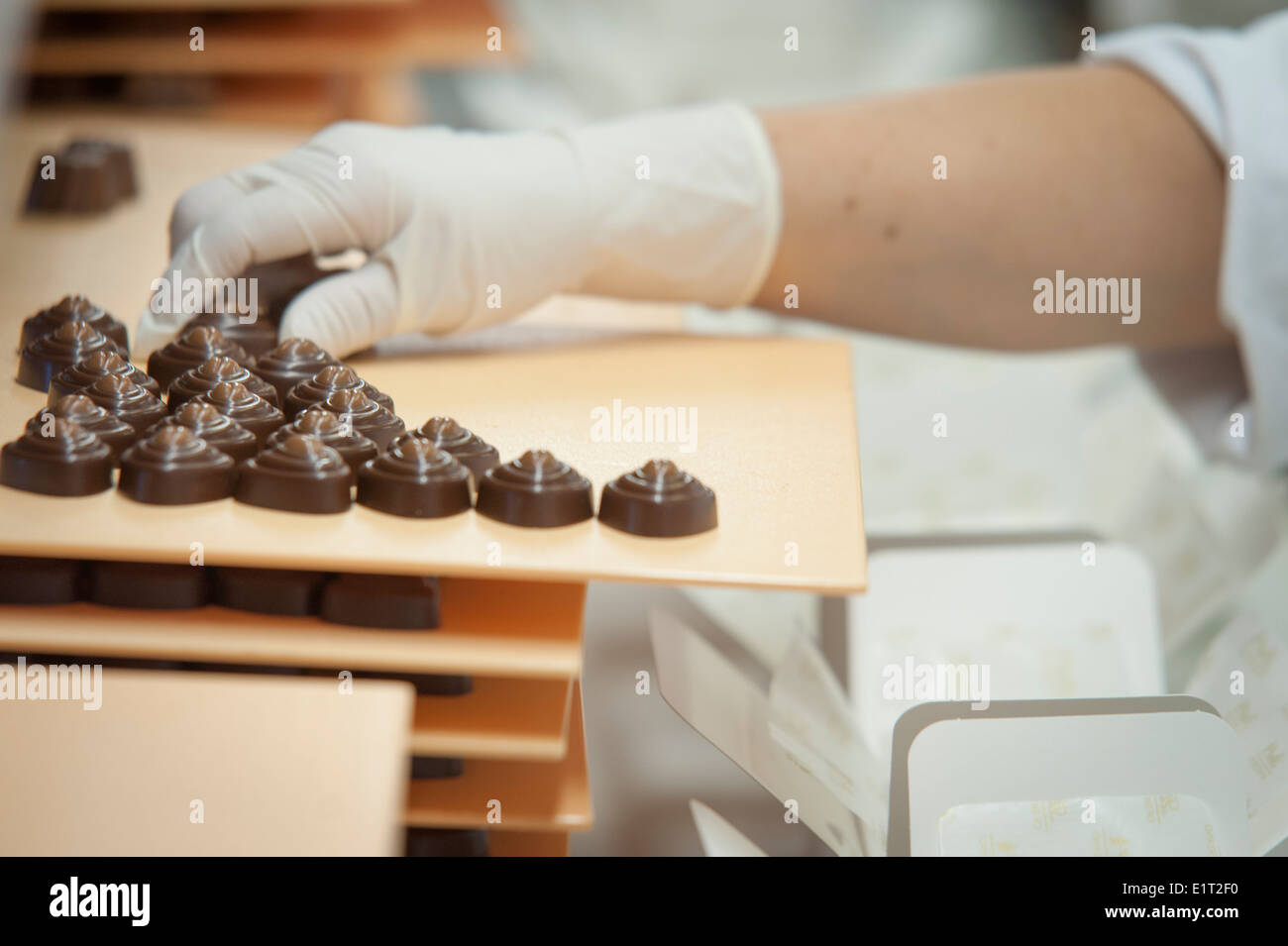 Workers at the Swiss chocolate factory of Lindt & Spruengli in Zurich Stock Photo, Royalty Free