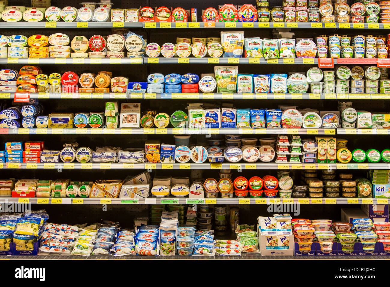 Shelf with food in a supermarket. milk products, cheese Stock Photo