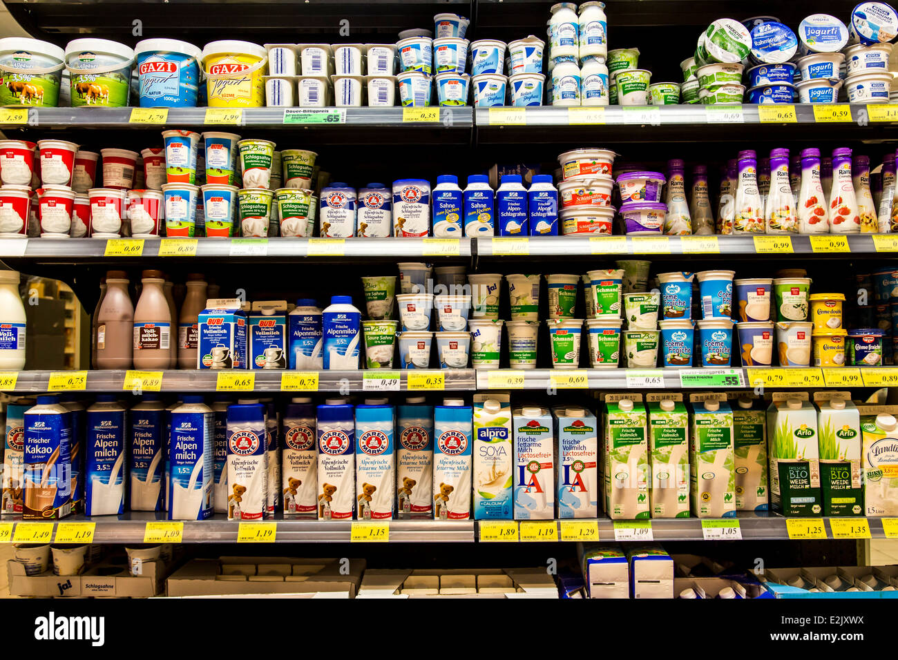 Shelf with food in a supermarket. Refrigerated, milk products Stock