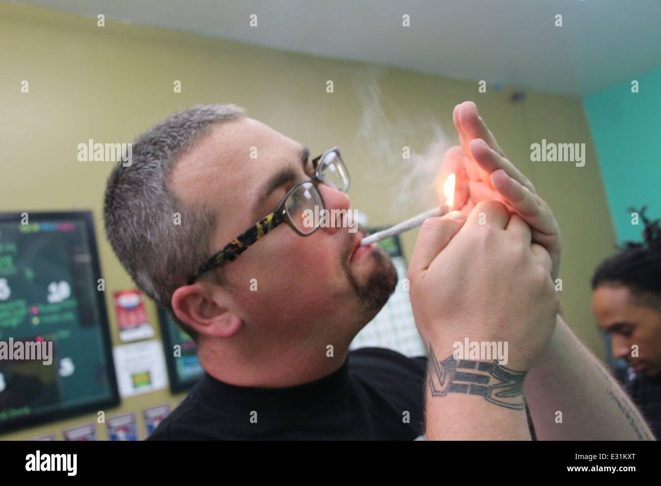 James Wade smoking a cigarette (or weed)
