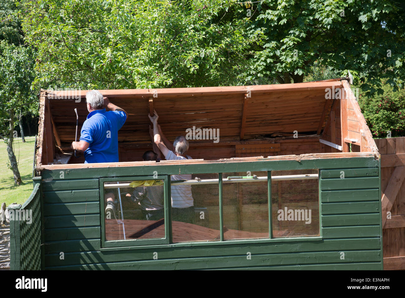 Garden Sheds Painted men demolishing an old green painted garden shed stock photo Garden Sheds Painted men demolishing an old green painted garden shed stock photo