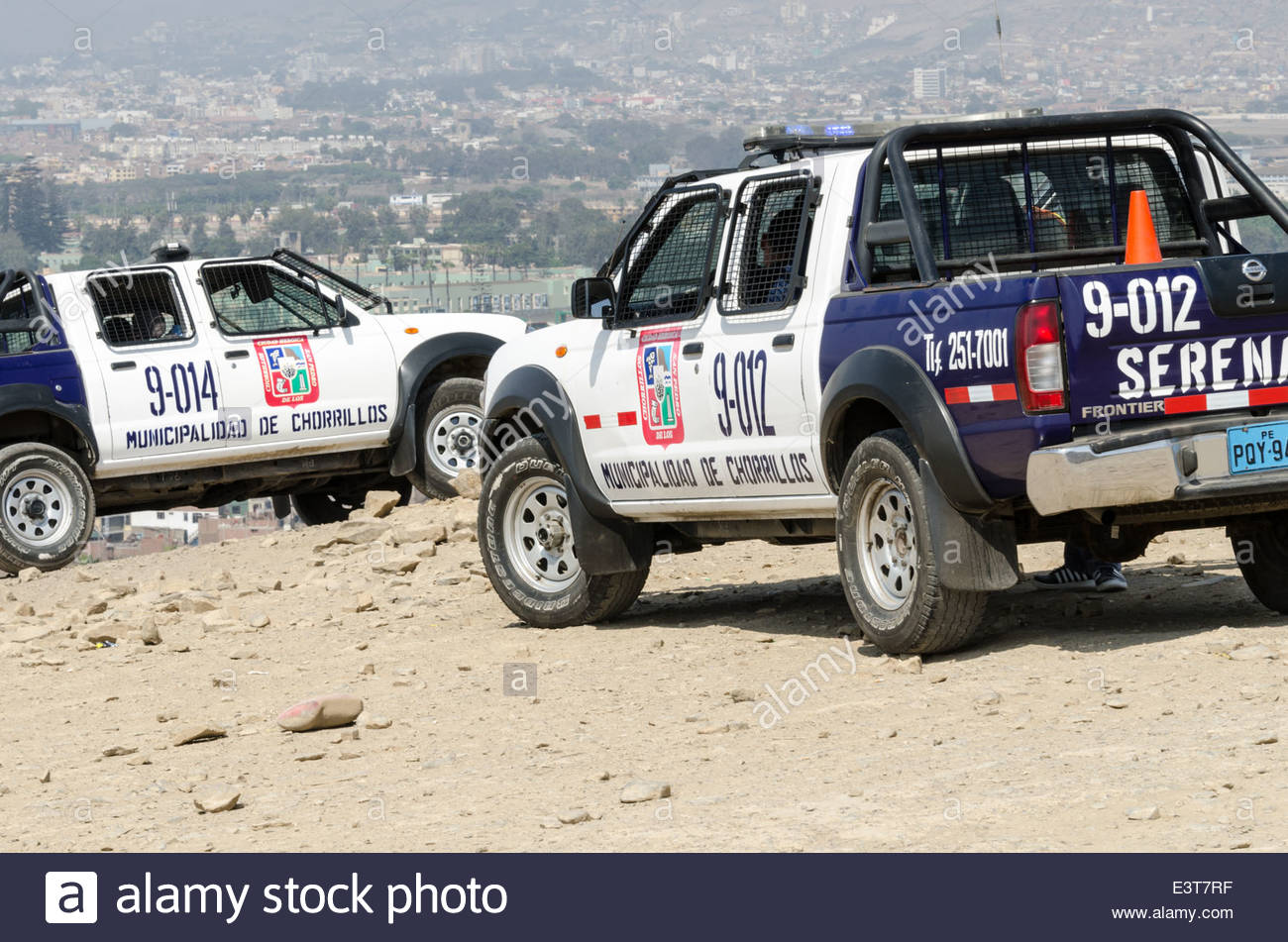Police car in front of city Peru Stock Photo, Royalty Free Image