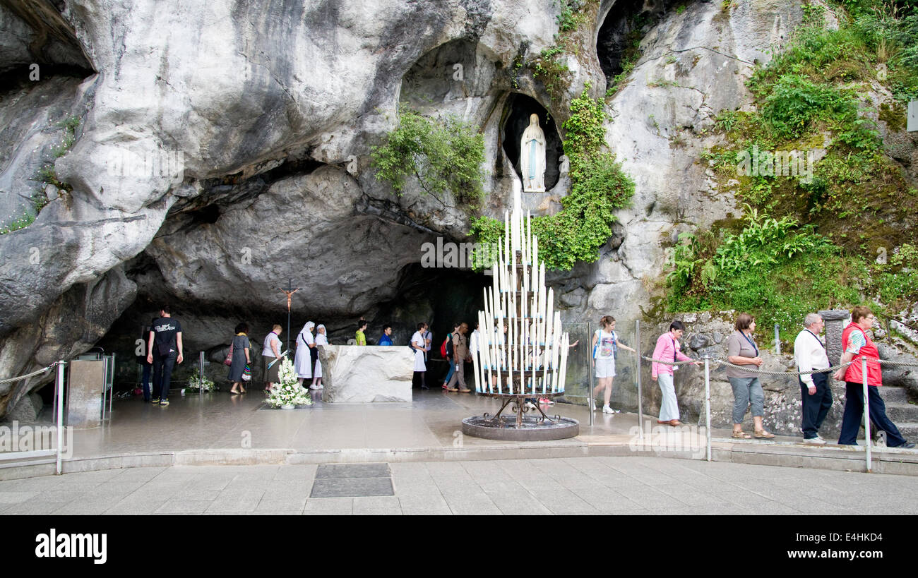 Statue of the Virgin Mary in the grotto of Lourdes Stock Photo, Royalty